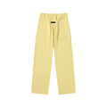 Fear Of God Essentials Tone‑on‑Tone Text Logo Straight‑Leg Sweatpants Pastel Yellow